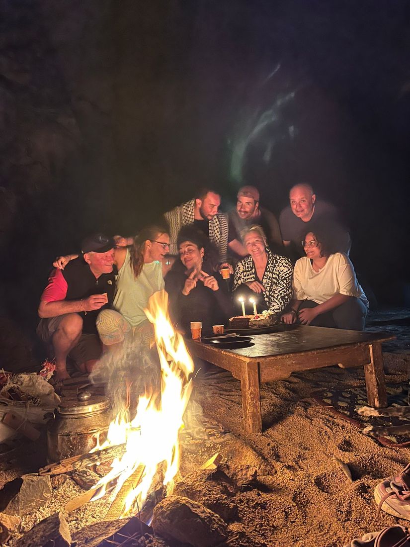 The group around the fire at a desert dinner