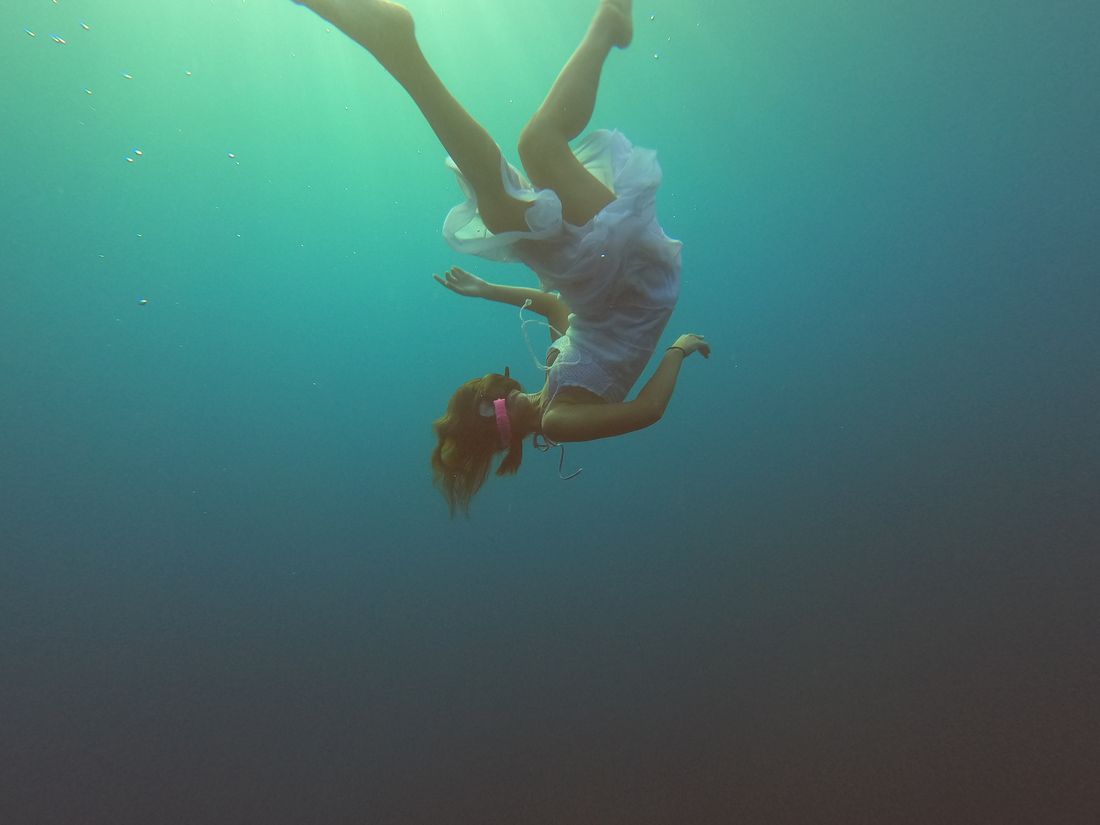 Two freedivers dancing through the freefall