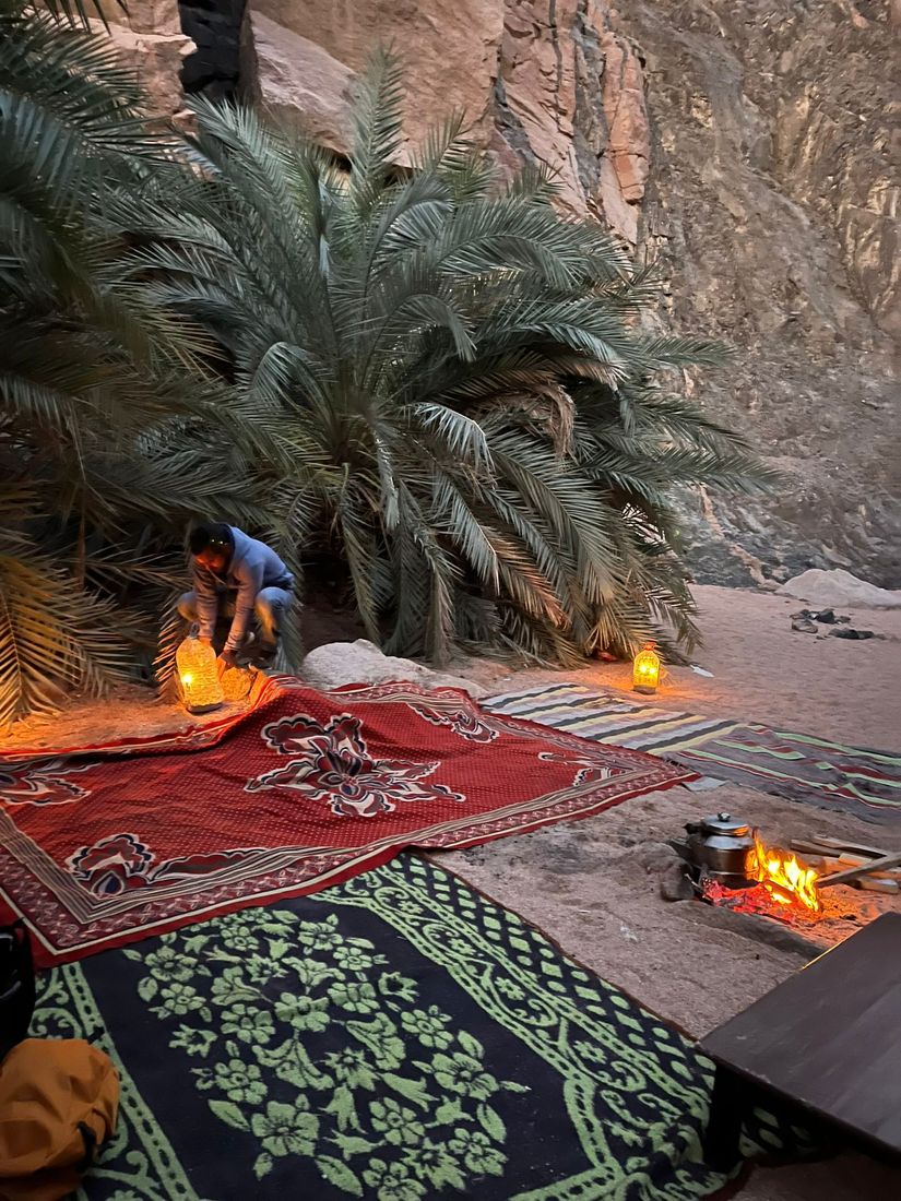 A desert camp with lanterns at Wadi Genai
