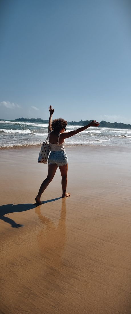 Arms up on the beach, Sri Lanka